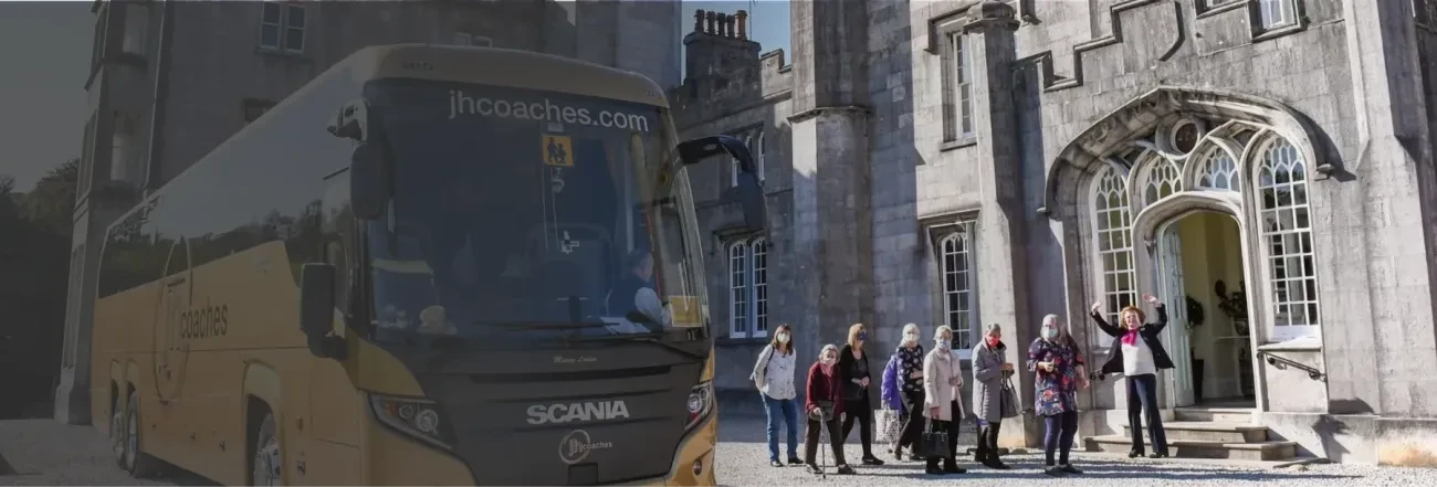 Coach outside stately home